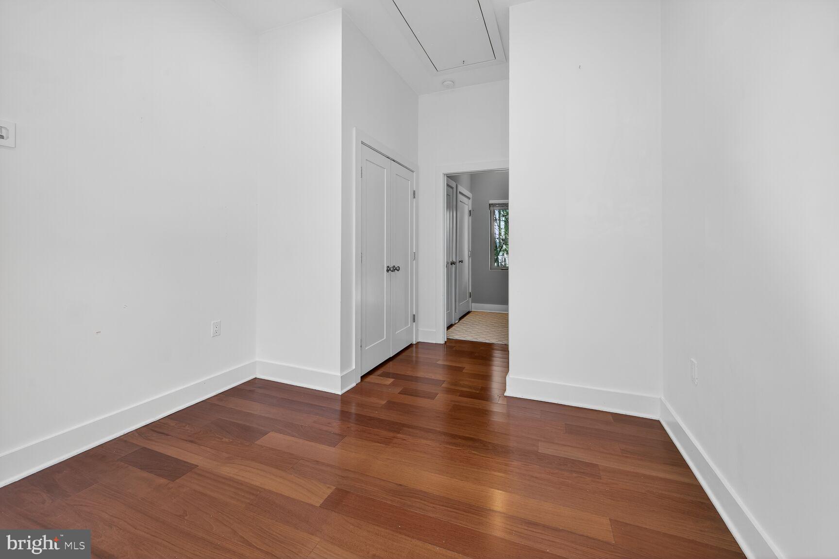 762 Park Road Northwest, Unit 7 Washington, DC 20010 - Photo 19 of 33 a view of an empty room with wooden floor