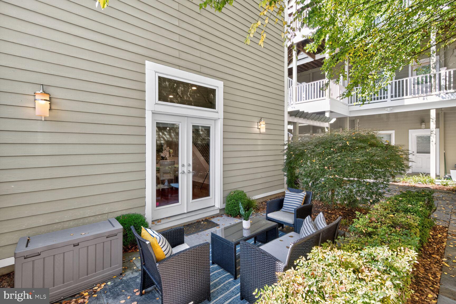 762 Park Road Northwest, Unit 7 Washington, DC 20010 - Photo 22 of 33 a view of a house with a chairs in patio
