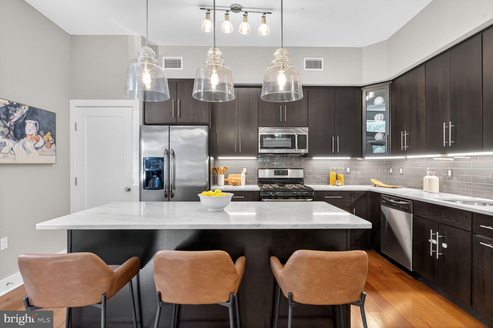 762 Park Road Northwest, Unit 7 Washington, DC 20010 - Photo 6 of 33 a kitchen with a sink cabinets and window