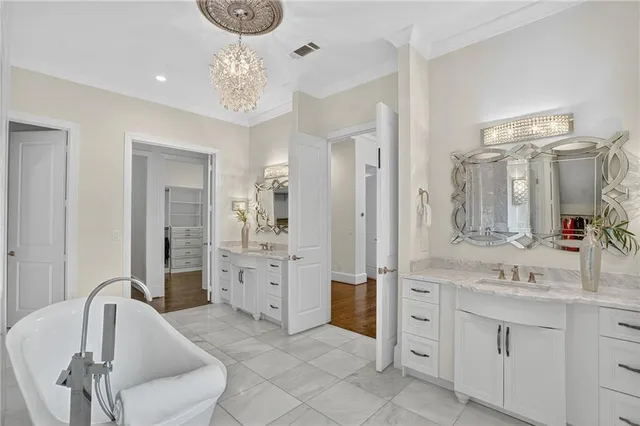 a kitchen with stainless steel appliances granite countertop a stove a refrigerator and a wooden cabinets