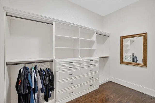a large kitchen with a table and chairs