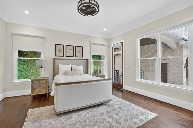 a kitchen with stainless steel appliances granite countertop a stove a sink a refrigerator and a wooden cabinets