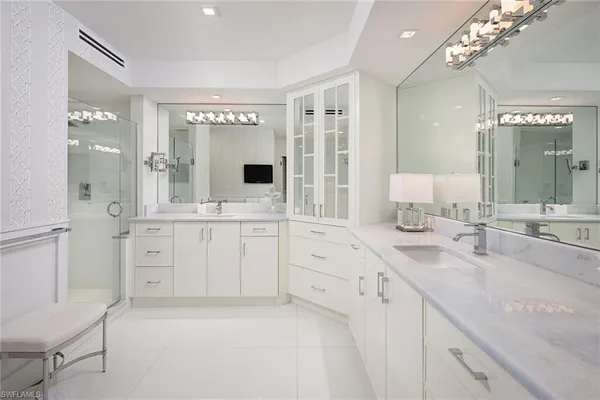 a spacious bathroom with a granite countertop sink mirror and a