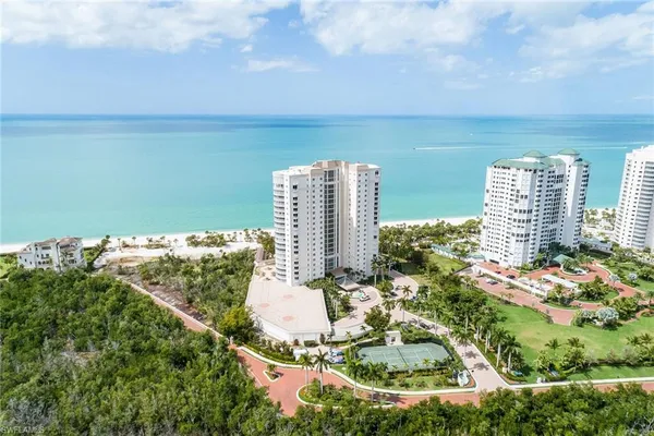 a view of a lake with tall buildings