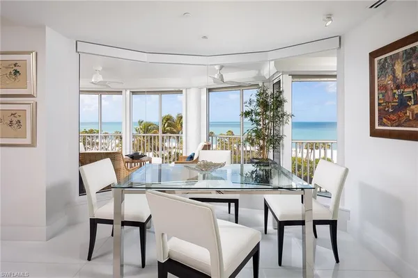 a dining room with furniture and window