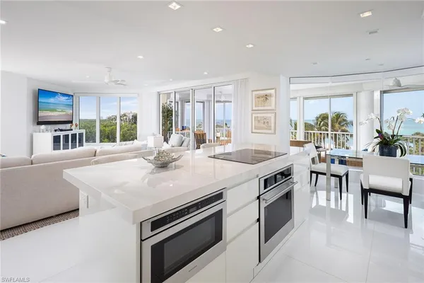 a kitchen with stainless steel appliances granite countertop a stove and a sink