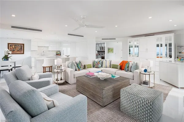 a living room with furniture and a table
