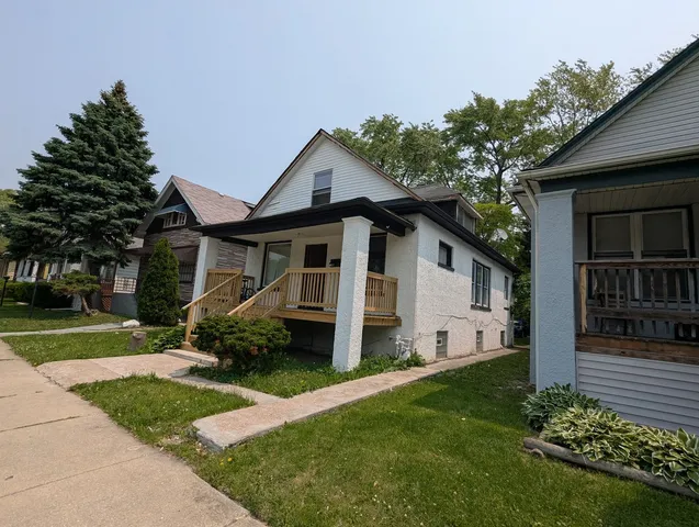 a house with trees in front of it