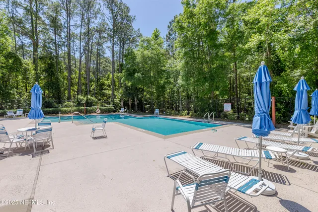 a view of a backyard with sitting area