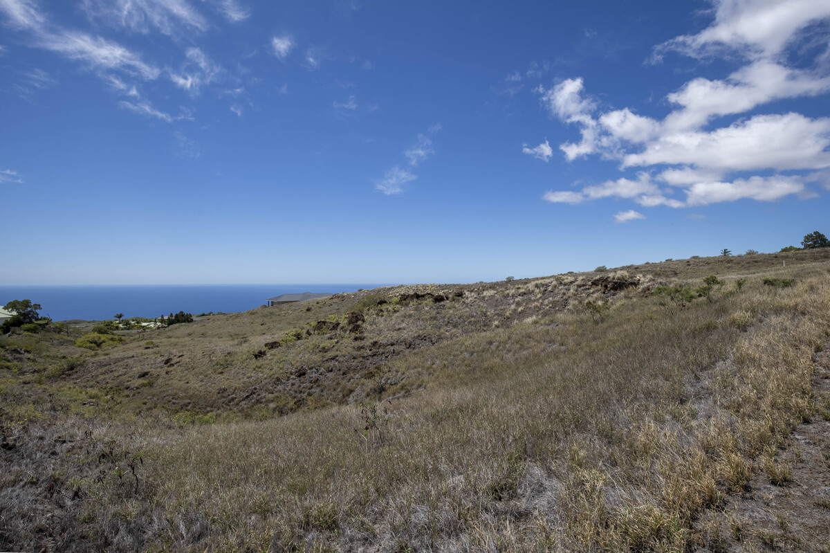 458 Lot Kamuela, HI 96743 - Photo 3 of 12 a view of a dry yard with mountains in the background