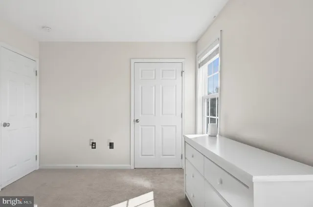 a bathroom with a granite countertop toilet a sink and a shower