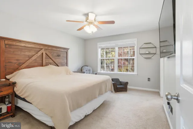 a en suite bathroom with a sink double vanity and a mirror