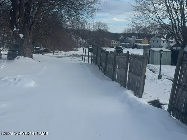 a view of a road with a snow on the road
