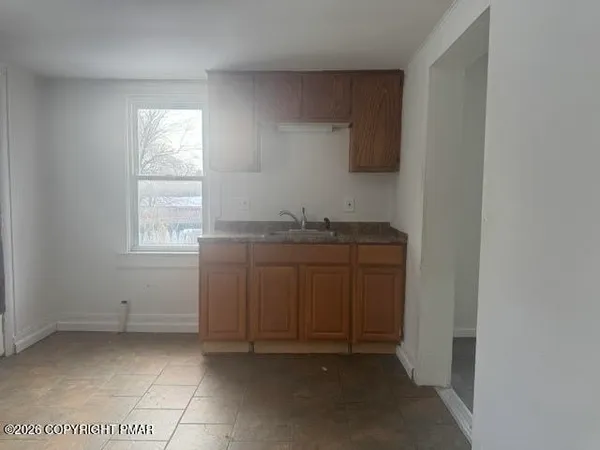 a room with a sink and a window