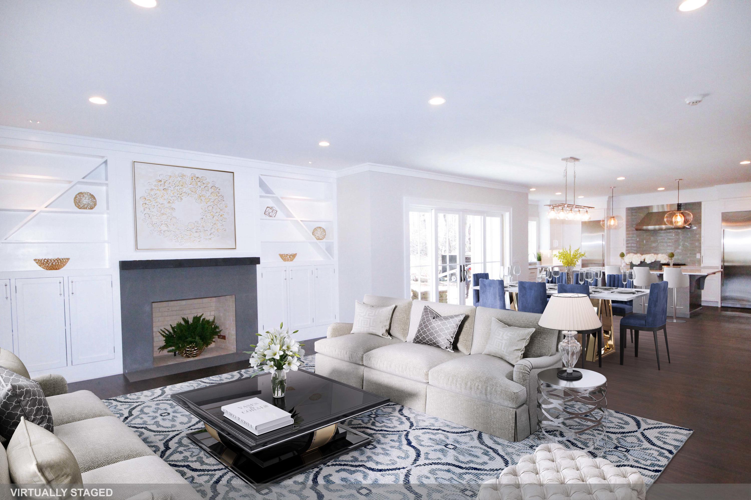 11 Rocaton Road Darien, CT 06820 - Photo 11 of 38 a living room with furniture potted plant and a fireplace