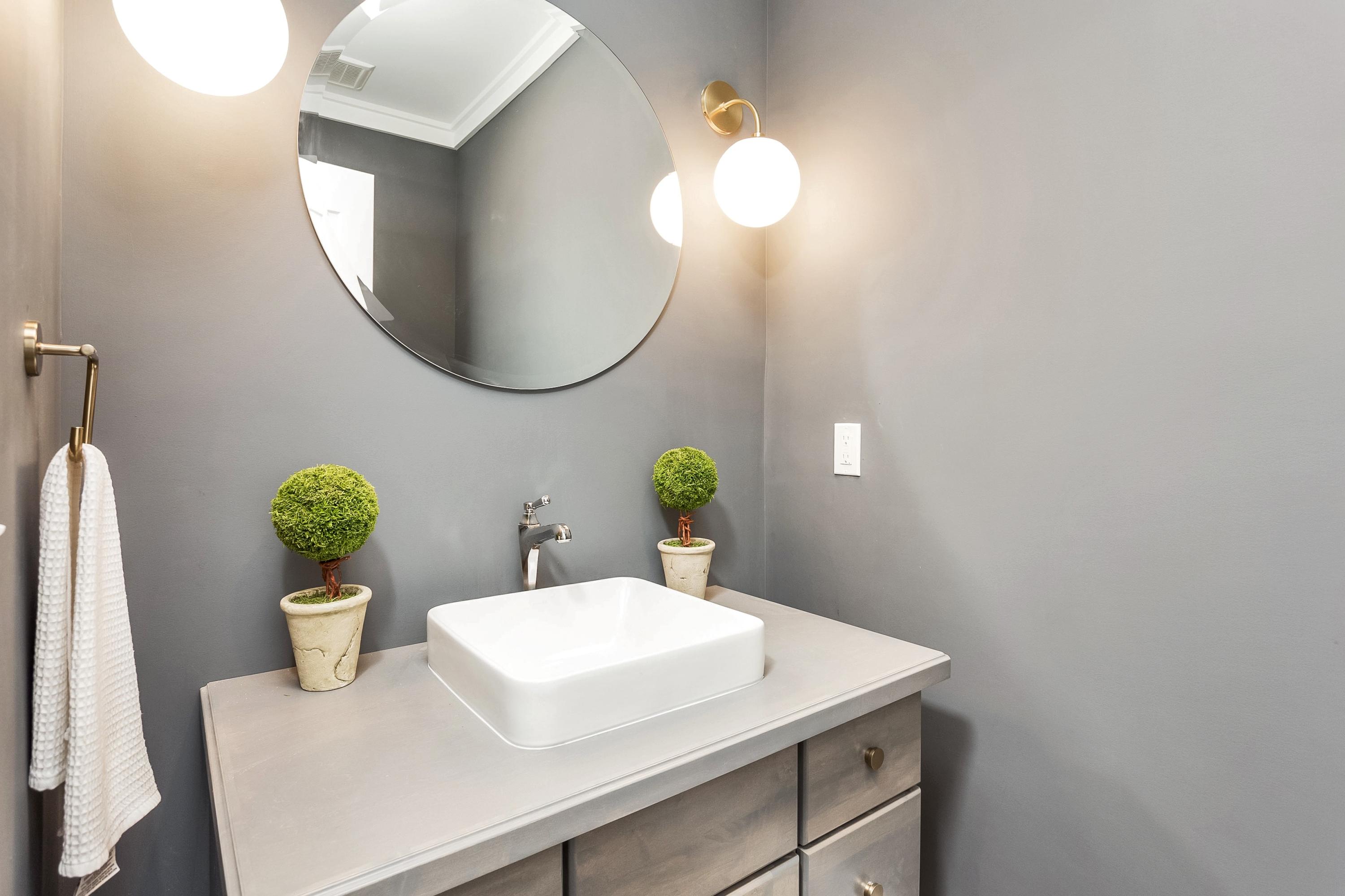 11 Rocaton Road Darien, CT 06820 - Photo 20 of 38 a bathroom with a sink a mirror and vanity