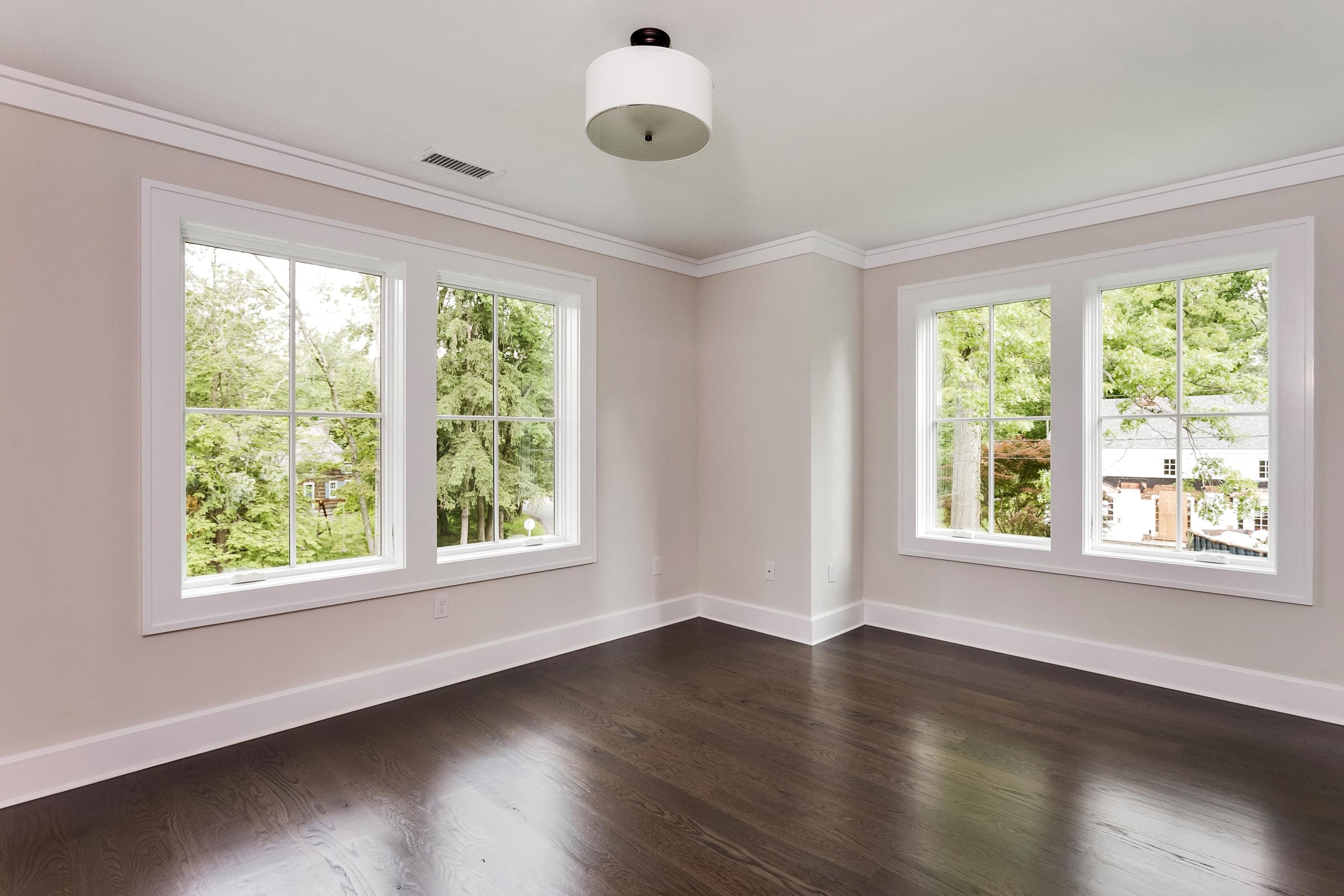 11 Rocaton Road Darien, CT 06820 - Photo 22 of 38 a view of an empty room with wooden floor and a window
