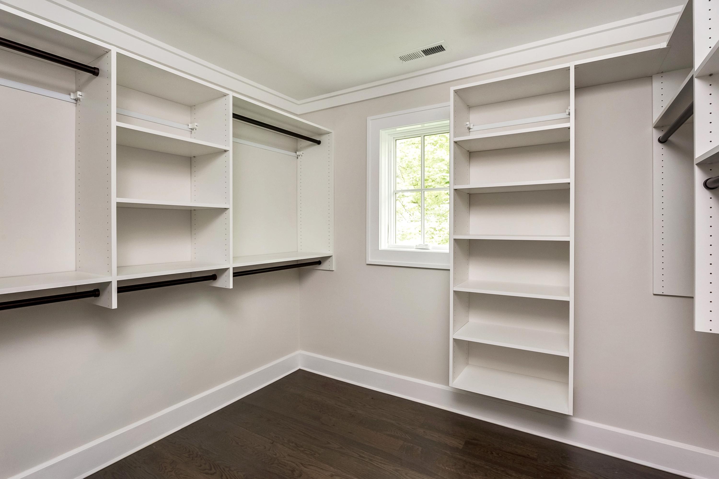 11 Rocaton Road Darien, CT 06820 - Photo 28 of 38 a view of an empty room with a window and wooden floor