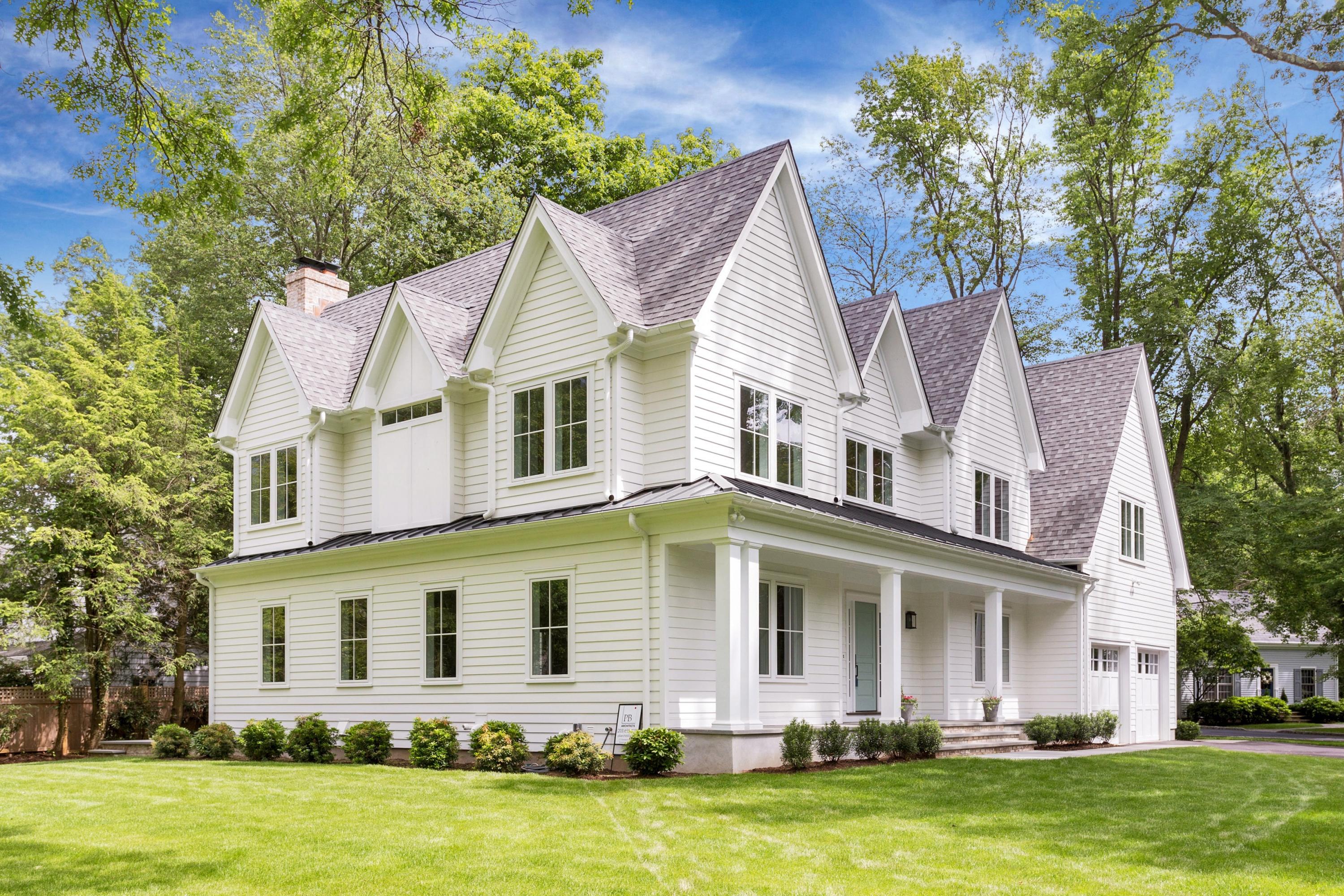 11 Rocaton Road Darien, CT 06820 - Photo 36 of 38 a front view of a house with a garden and swimming pool