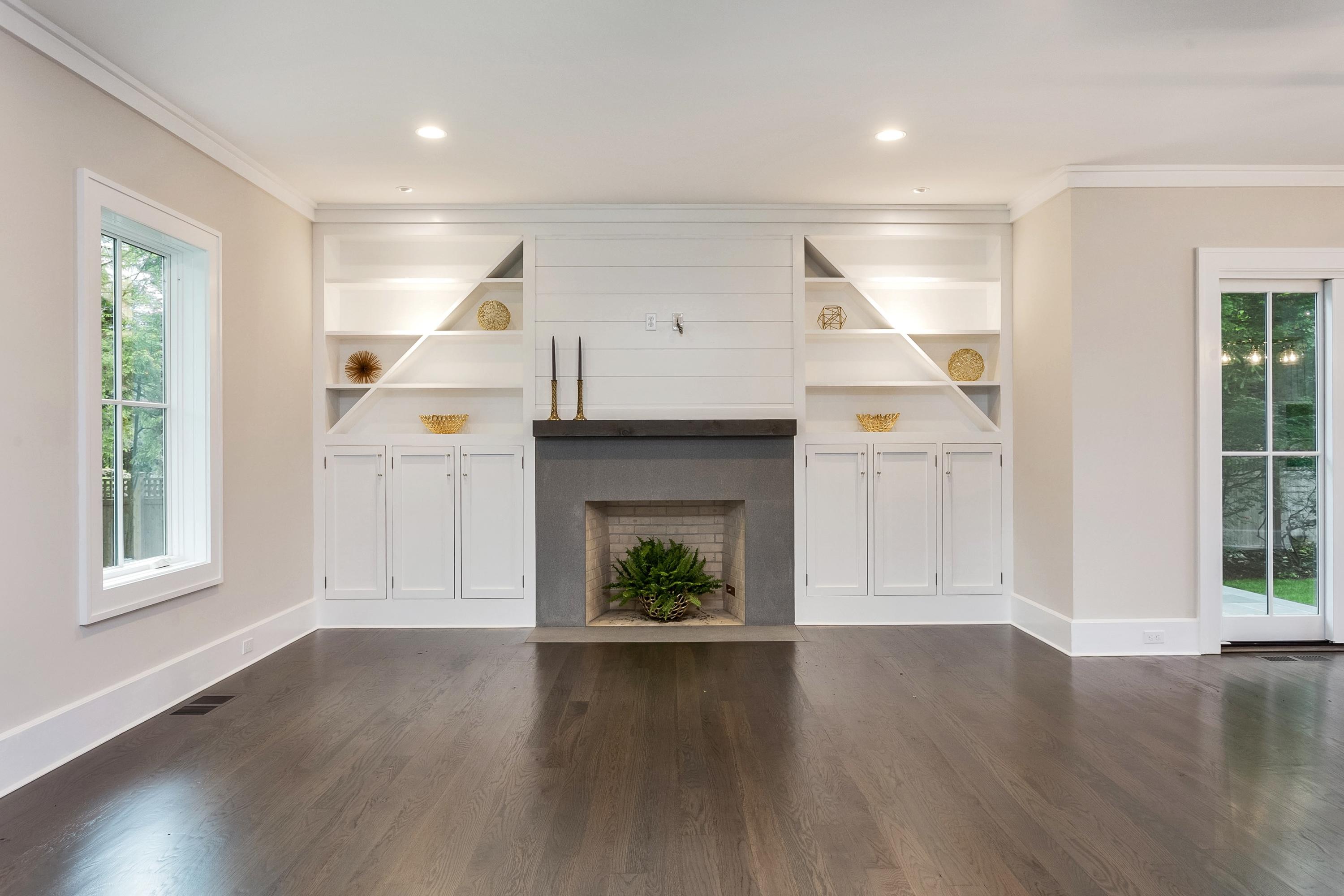 11 Rocaton Road Darien, CT 06820 - Photo 7 of 38 an empty room with windows and fireplace