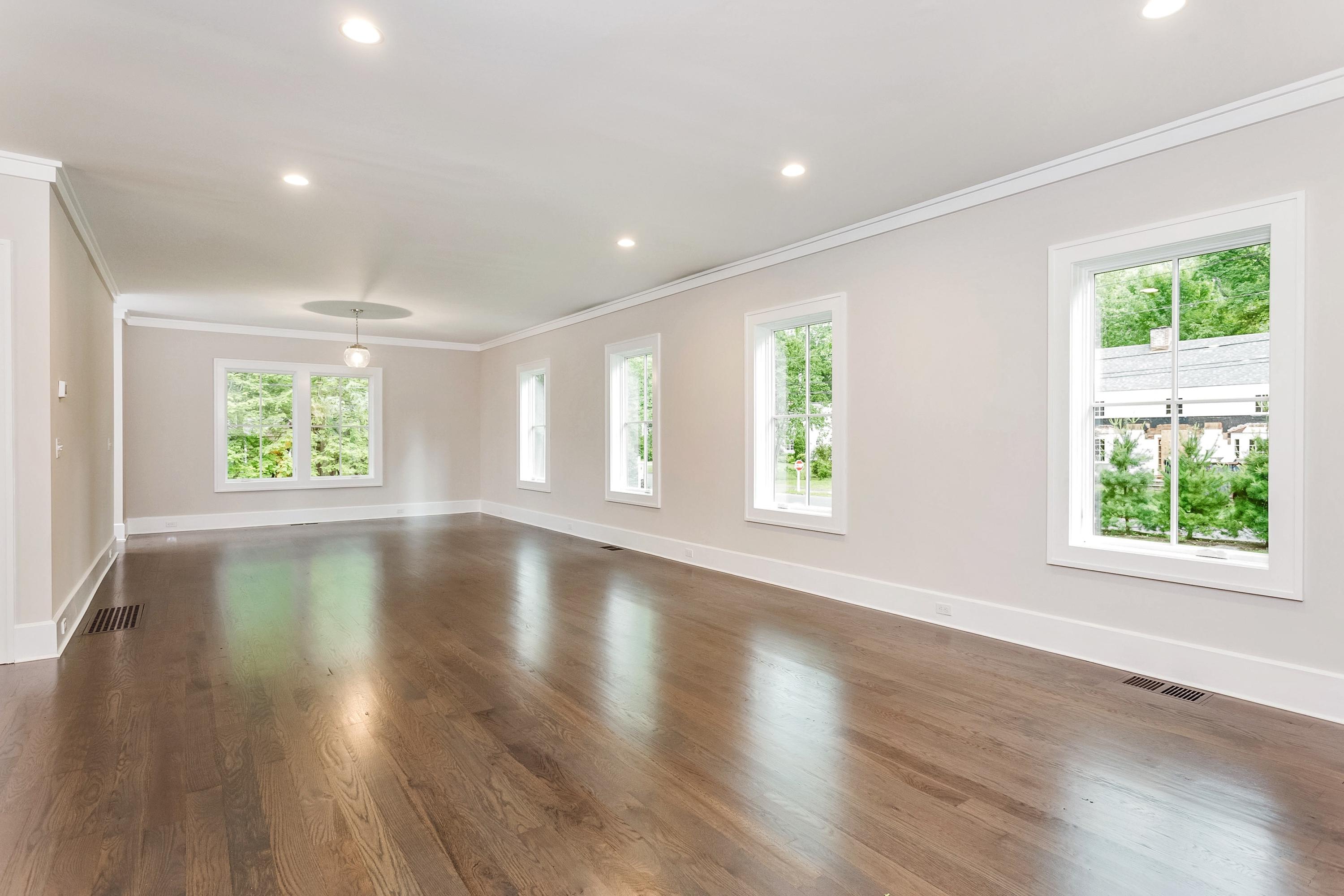 11 Rocaton Road Darien, CT 06820 - Photo 8 of 38 an empty room with wooden floor and windows