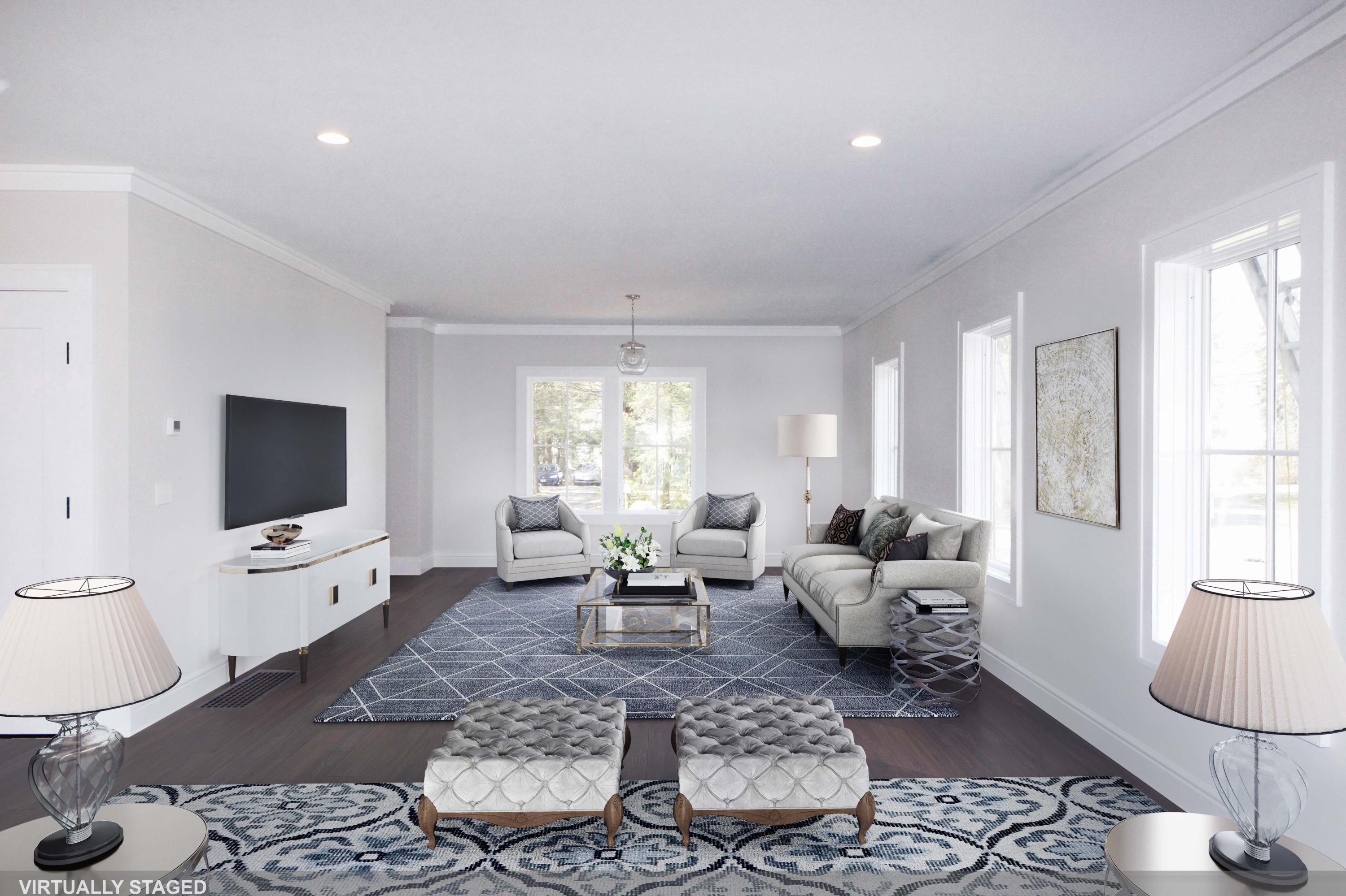 11 Rocaton Road Darien, CT 06820 - Photo 9 of 38 a living room with furniture a flat screen tv and a large window