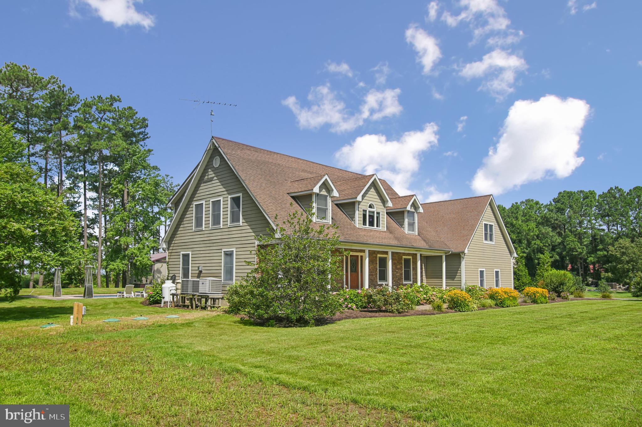 6670 Tilghman Island Road Sherwood, MD 21665 - Photo 11 of 64 a front view of a house with a yard