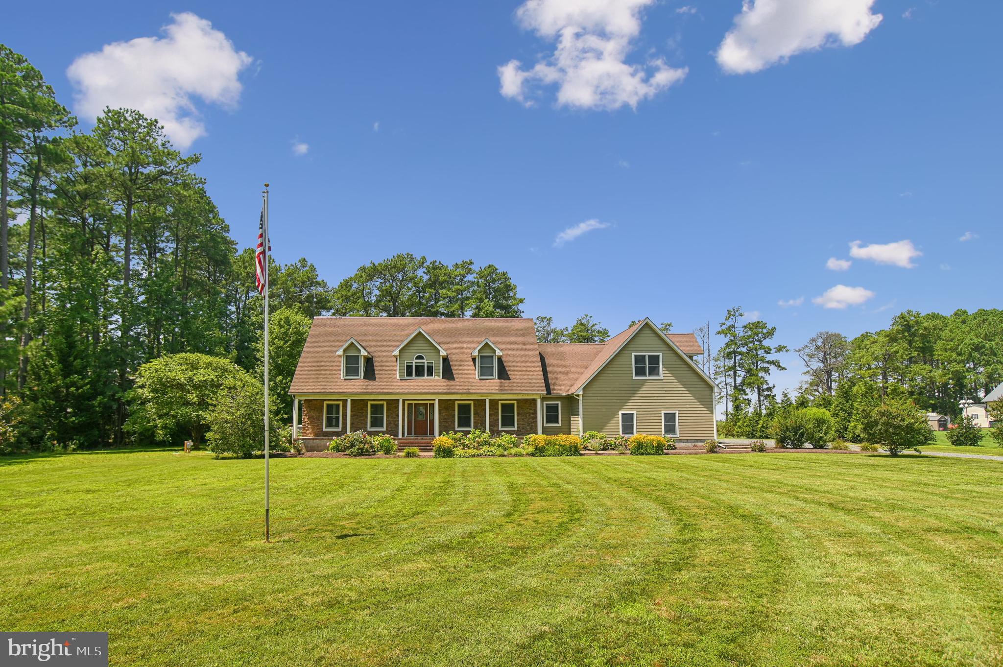 6670 Tilghman Island Road Sherwood, MD 21665 - Photo 14 of 64 a front view of a house with a big yard