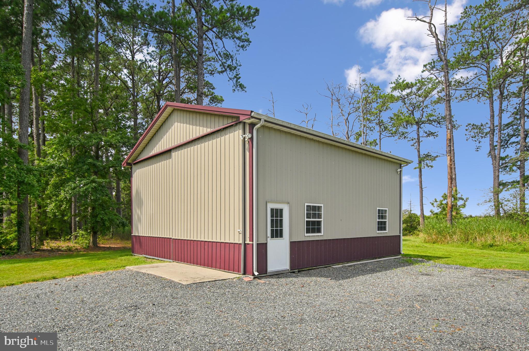 6670 Tilghman Island Road Sherwood, MD 21665 - Photo 15 of 64 a view of backyard of house and garage