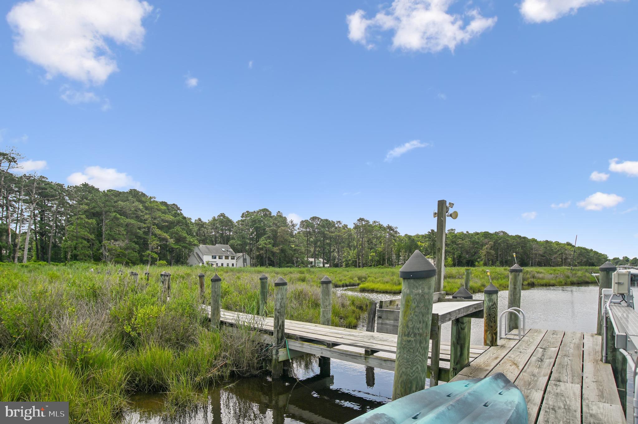 6670 Tilghman Island Road Sherwood, MD 21665 - Photo 17 of 64 a view of a lake with couches in front of house