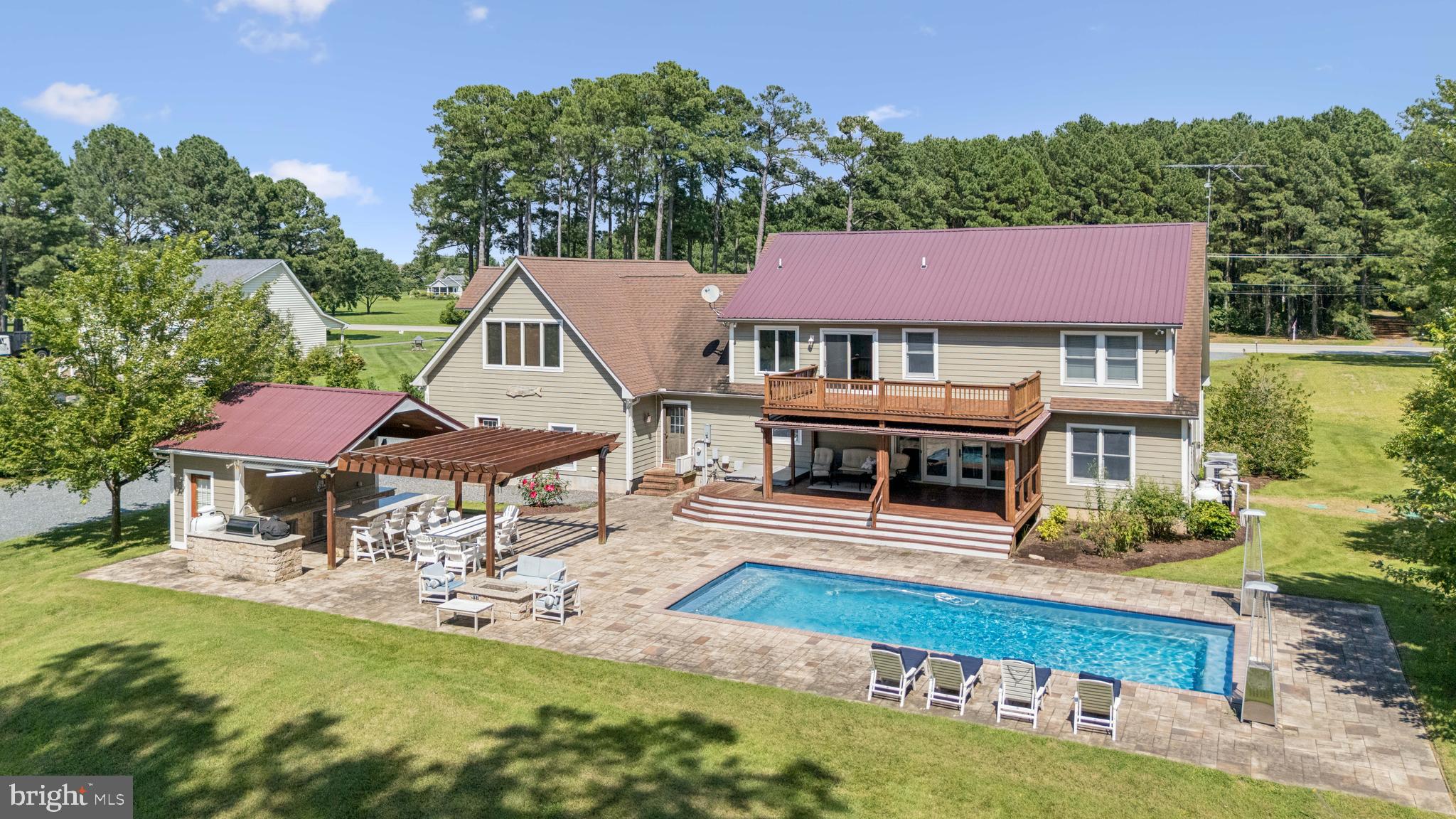 6670 Tilghman Island Road Sherwood, MD 21665 - Photo 2 of 64 an aerial view of a house with swimming pool garden view and a bench