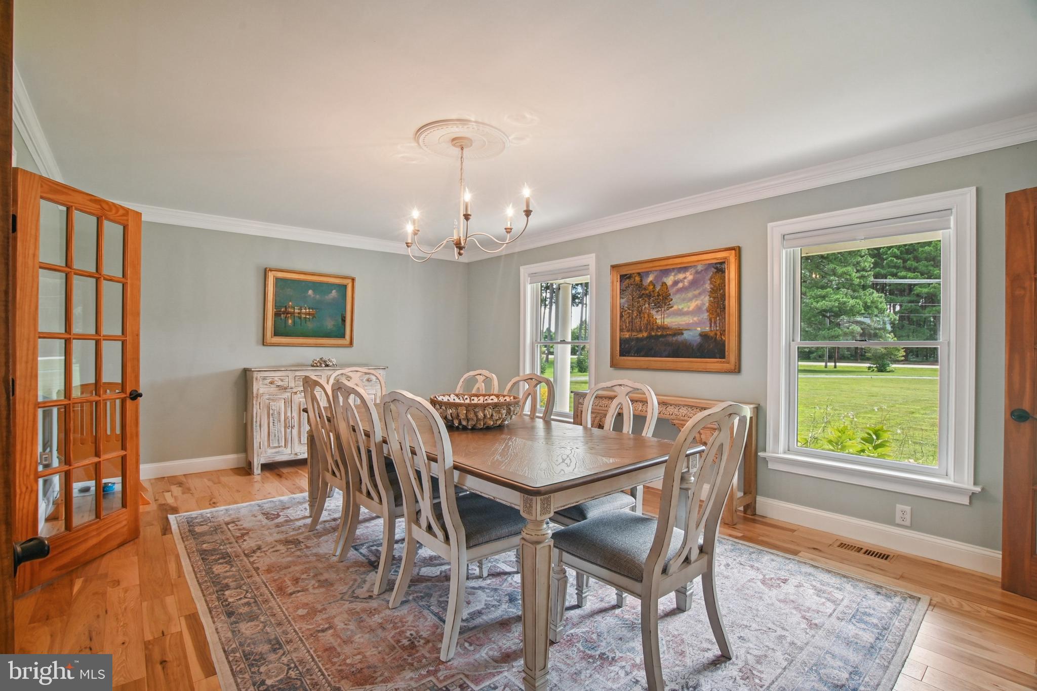 6670 Tilghman Island Road Sherwood, MD 21665 - Photo 26 of 64 a view of a dining room with furniture window and wooden floor