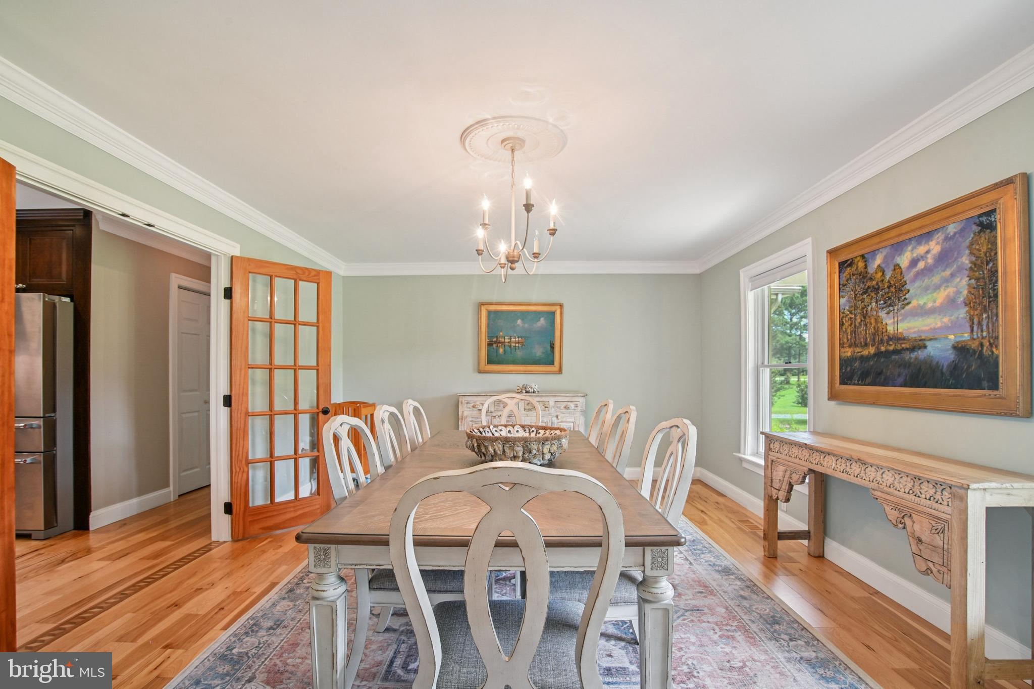 6670 Tilghman Island Road Sherwood, MD 21665 - Photo 28 of 64 a view of a dining room with furniture window and wooden floor