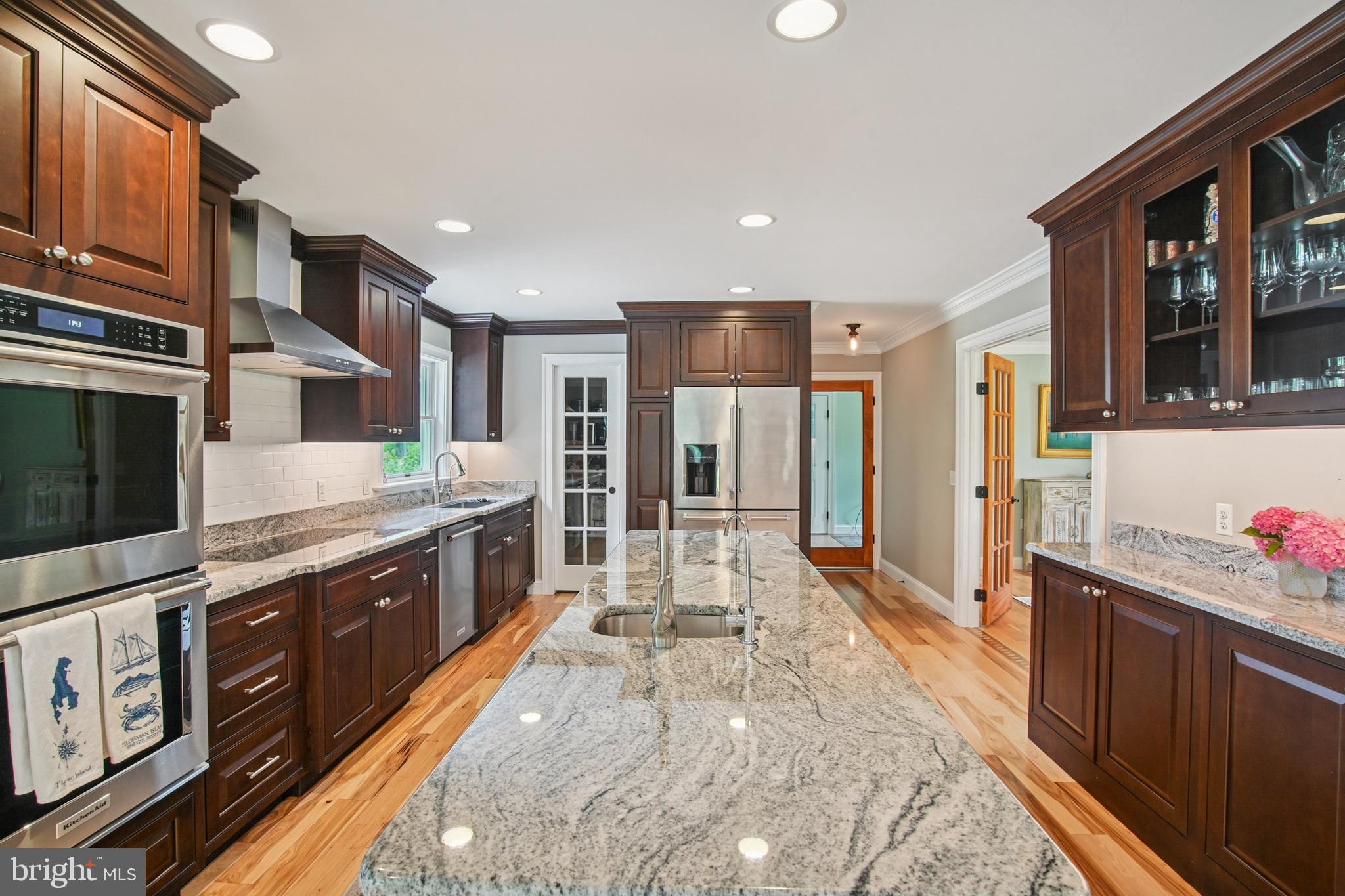 6670 Tilghman Island Road Sherwood, MD 21665 - Photo 29 of 64 a large kitchen with stainless steel appliances wooden cabinets and a stove top oven