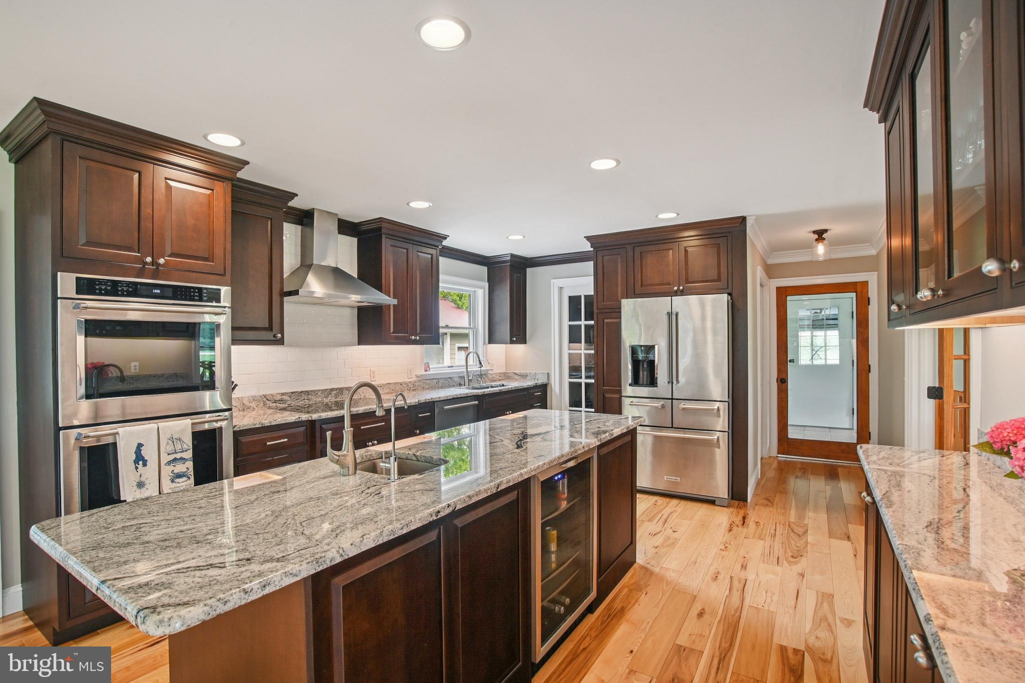 6670 Tilghman Island Road Sherwood, MD 21665 - Photo 30 of 64 a kitchen with stainless steel appliances granite countertop a refrigerator a stove and a sink