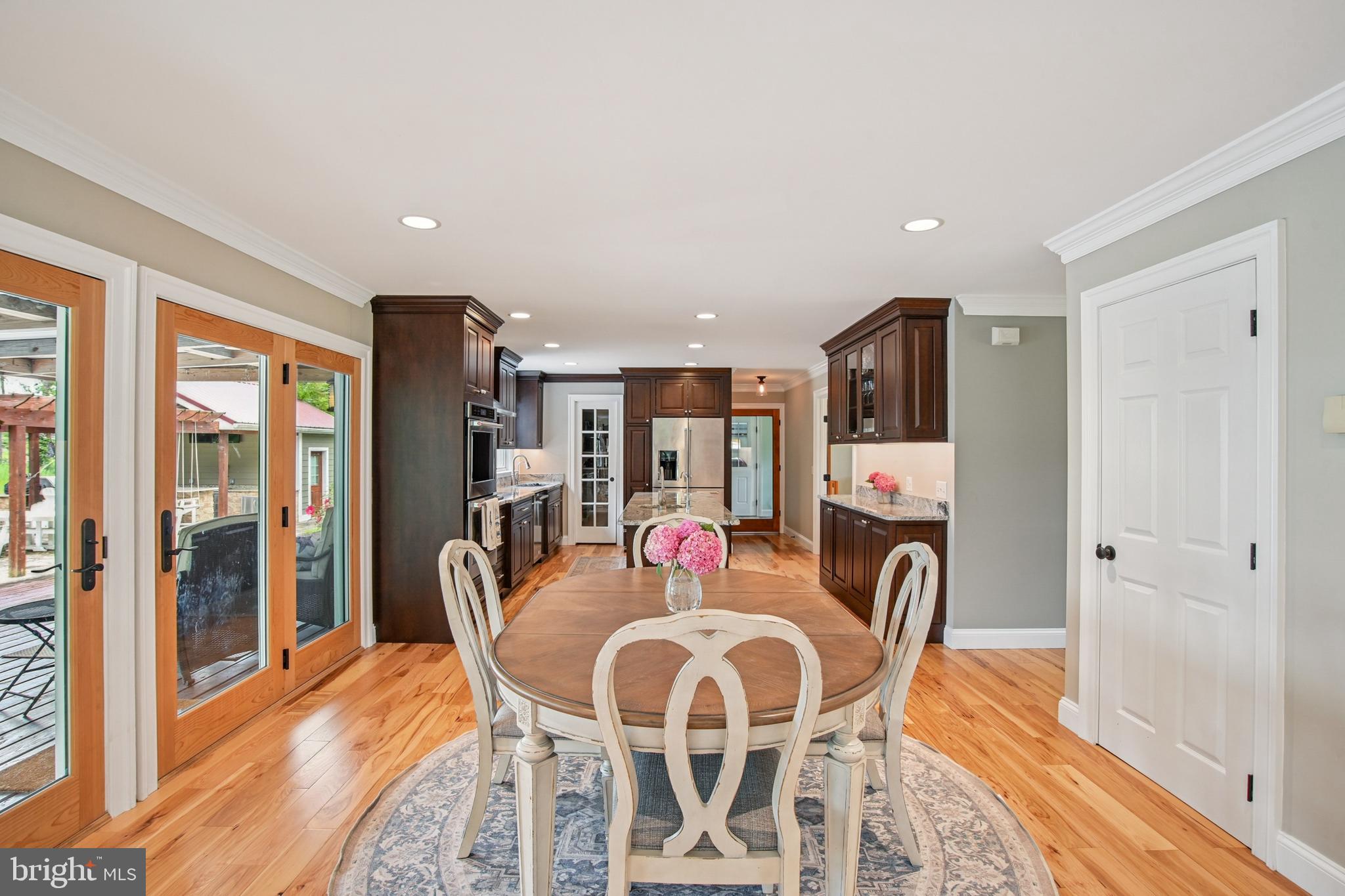 6670 Tilghman Island Road Sherwood, MD 21665 - Photo 34 of 64 a view of a dining room with furniture window and wooden floor