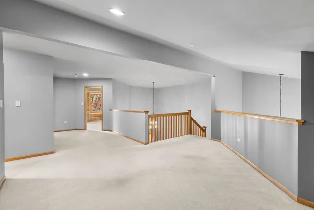 a view of a bedroom with closet and windows