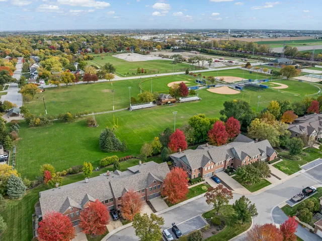 an aerial view of a house with a swimming pool