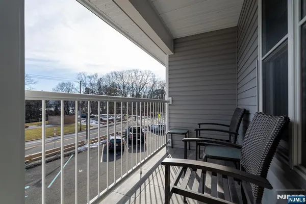 a view of a balcony with furniture