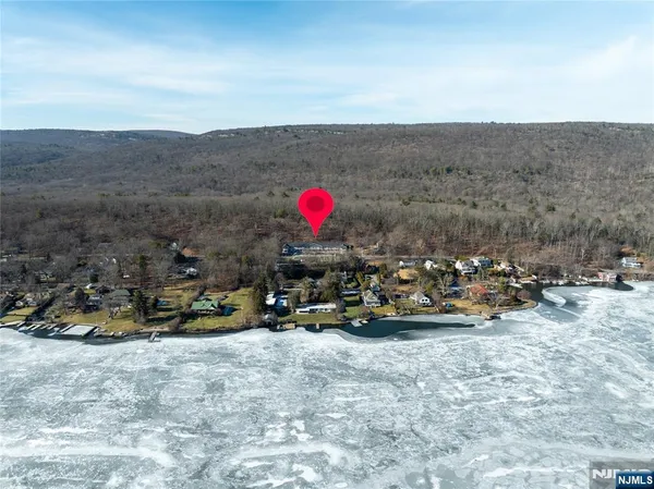 a view of a park with some cars parked