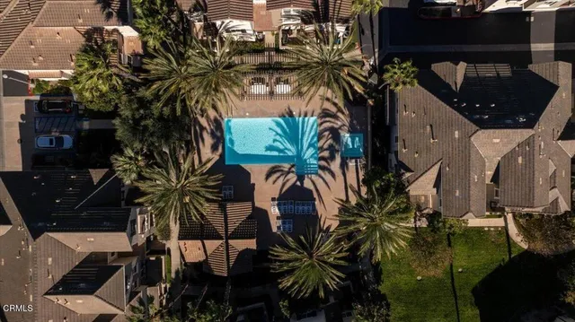 a swimming pool with outdoor seating and yard