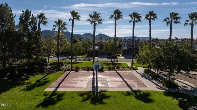 a view of a house with a garden and a mountain view