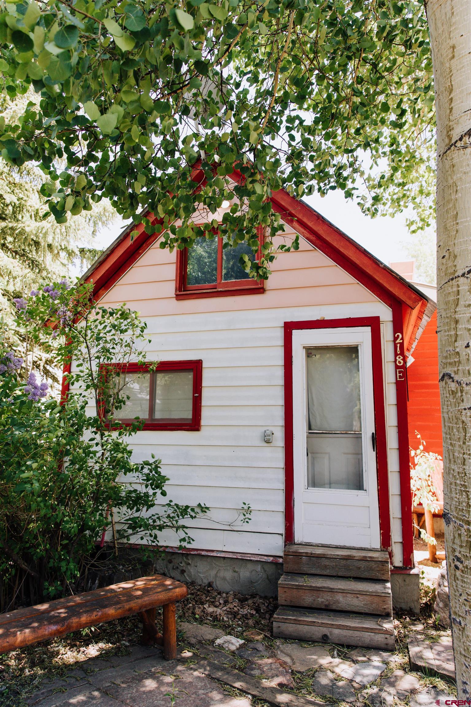 218 Maroon Avenue, Unit E Crested Butte, CO 81224 - Photo 18 of 22 a backyard of a house with lots of green space