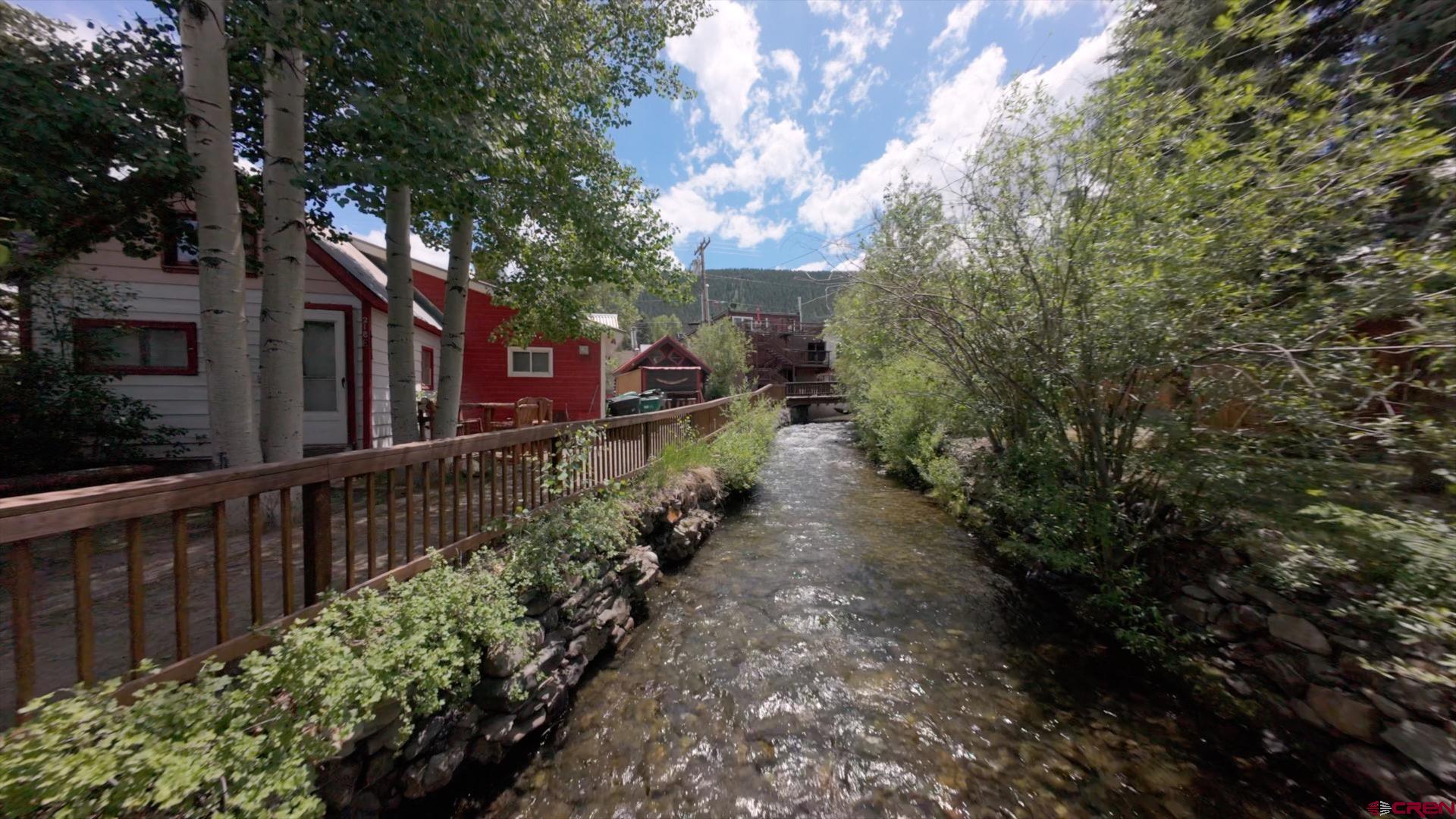 218 Maroon Avenue, Unit E Crested Butte, CO 81224 - Photo 19 of 22 a view of a pathway with a wrought fence