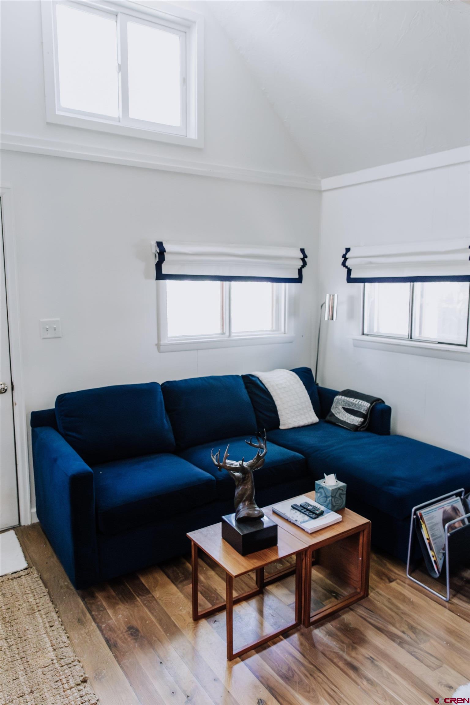 218 Maroon Avenue, Unit E Crested Butte, CO 81224 - Photo 7 of 22 a living room with furniture and a wooden floor