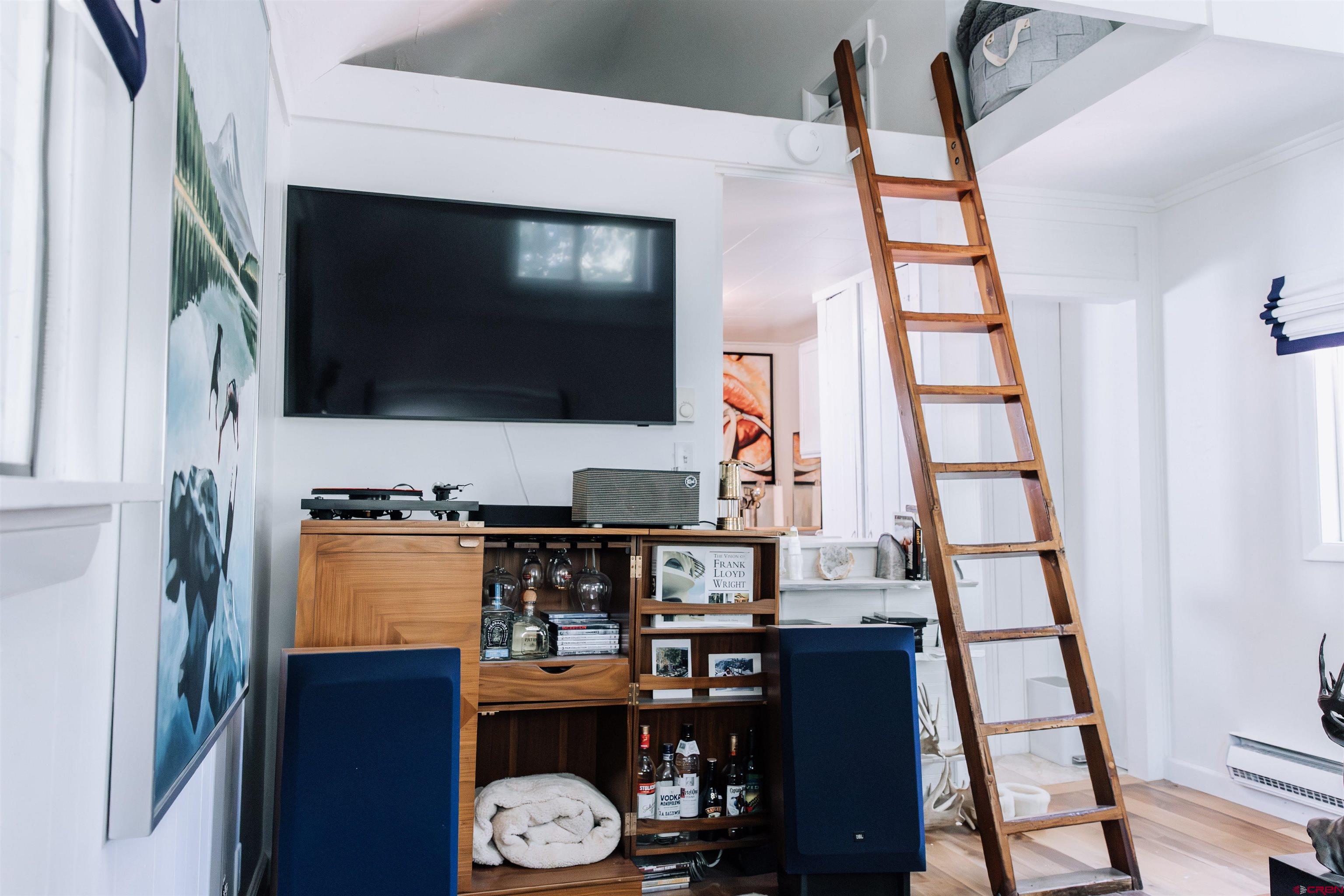 218 Maroon Avenue, Unit E Crested Butte, CO 81224 - Photo 9 of 22 a living room with furniture and a flat screen tv