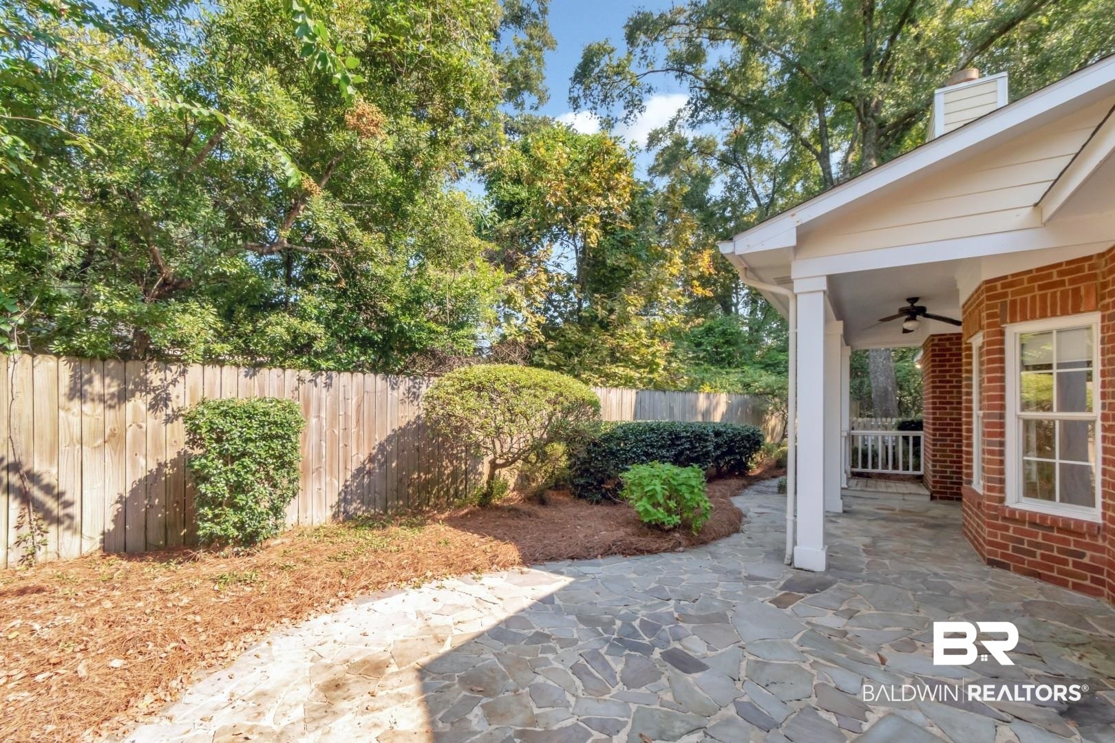 105 McHugh Lane Mobile, AL 36608 - Photo 24 of 30 Fenced backyard featuring a patio and a ceiling fan