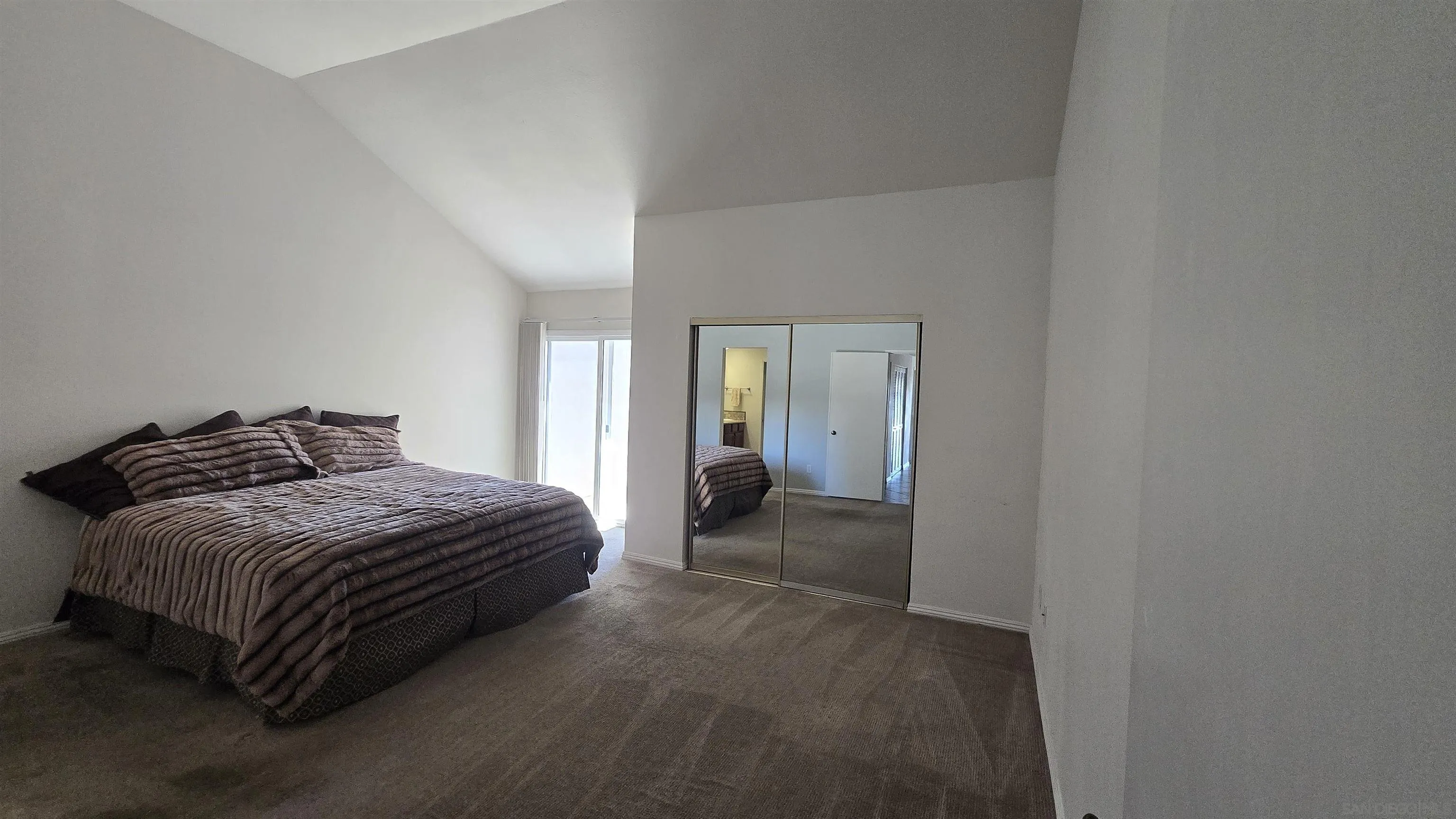 13592 Ridley Road San Diego, CA 92129 - Photo 22 of 25 a bedroom with a bed and a mirror