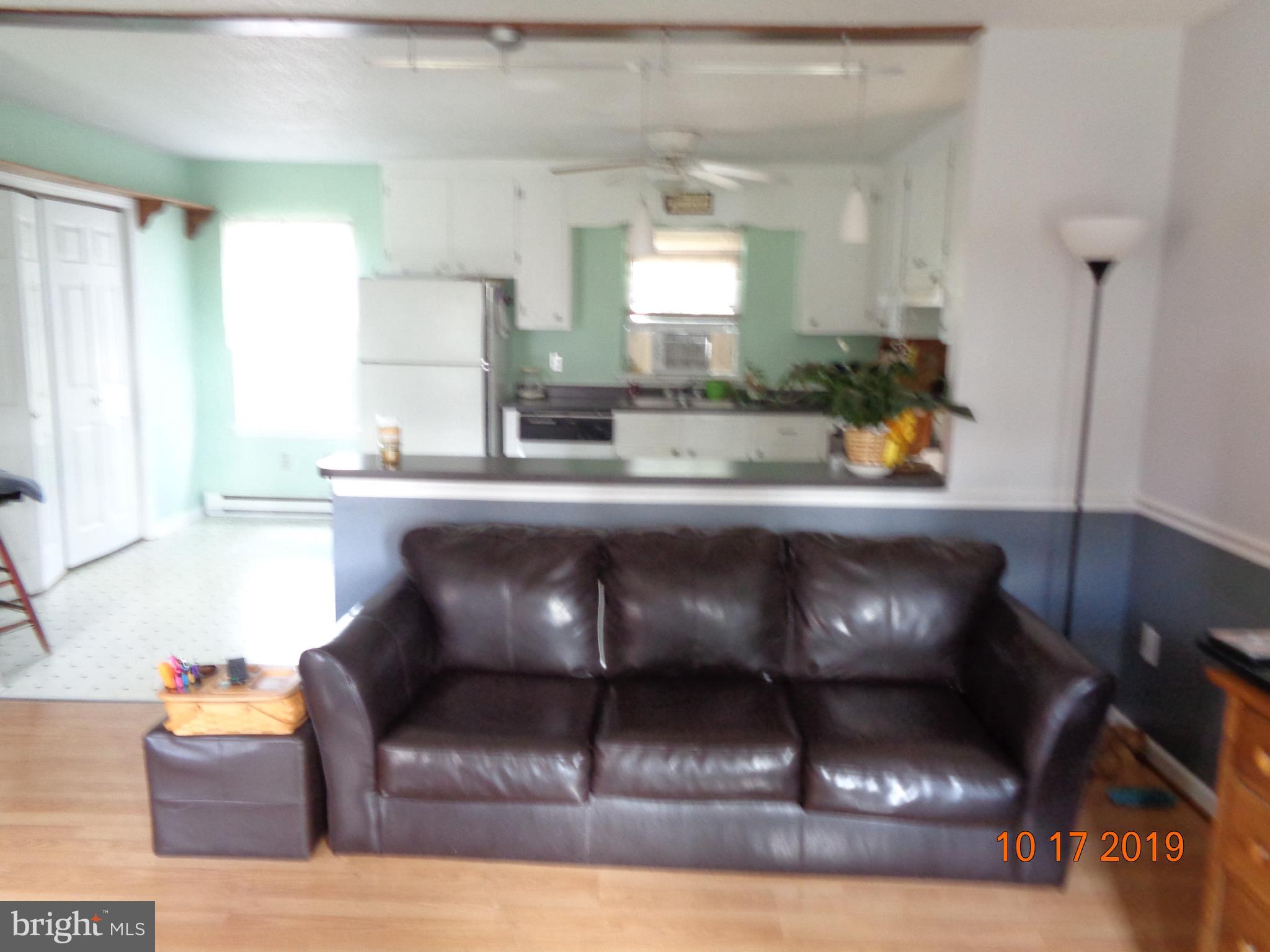 39 Coolidge Road Inwood, WV 25428 - Photo 8 of 26 LIVING ROOM OPENS TO KITCHEN