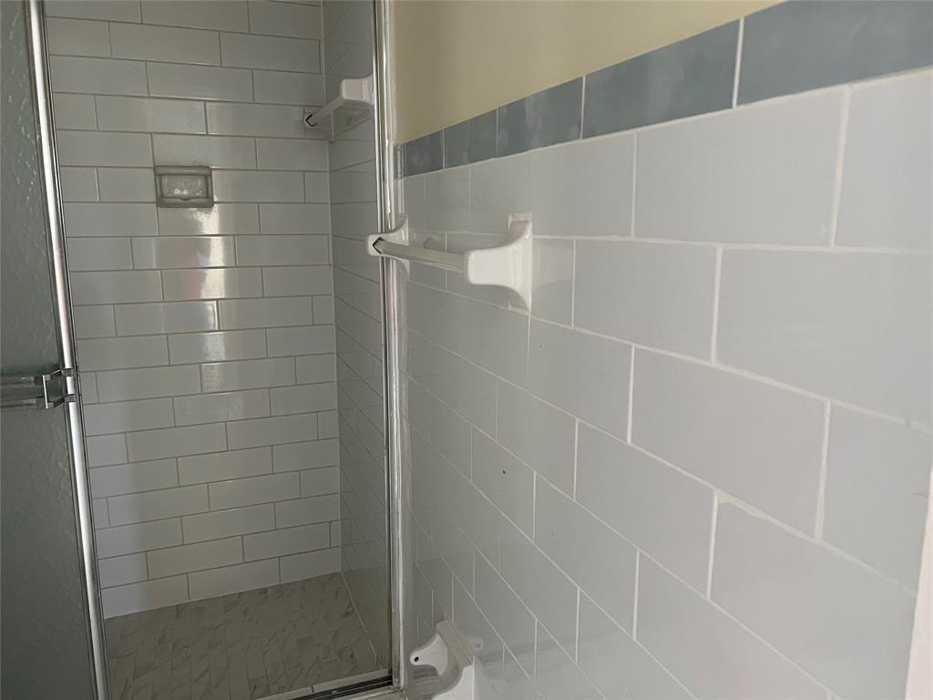 Royal Oaks Miami, FL 33179 - Photo 5 of 9 a bathroom with a shower